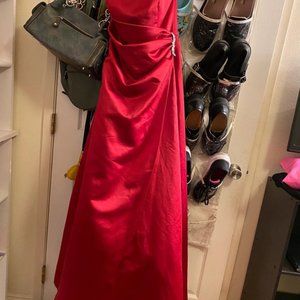 David’s bridal red satin strapless side drape bridal gown with brooch